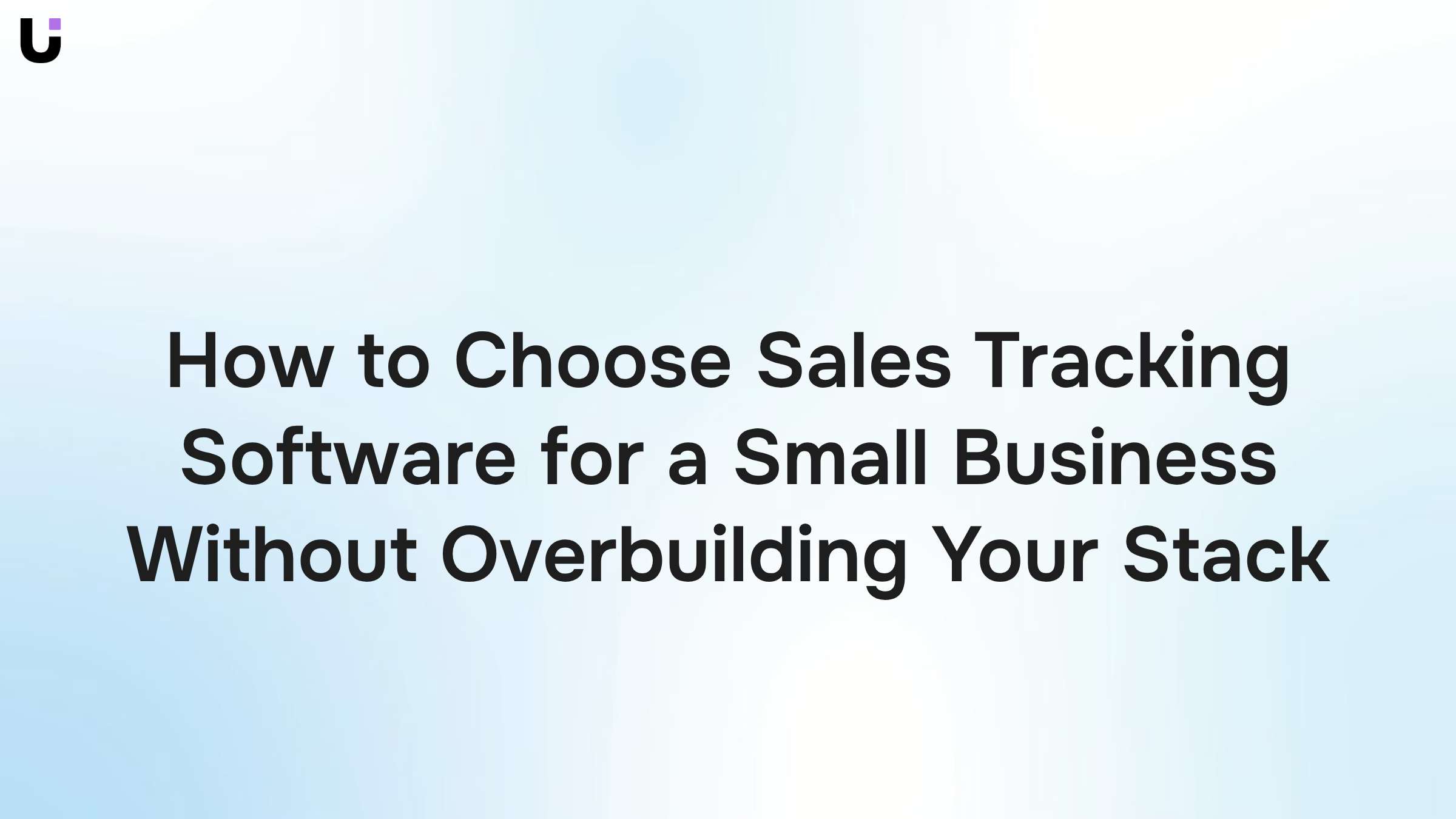 Clean professional workspace with dashboard analytics on monitor representing sales tracking software for small business