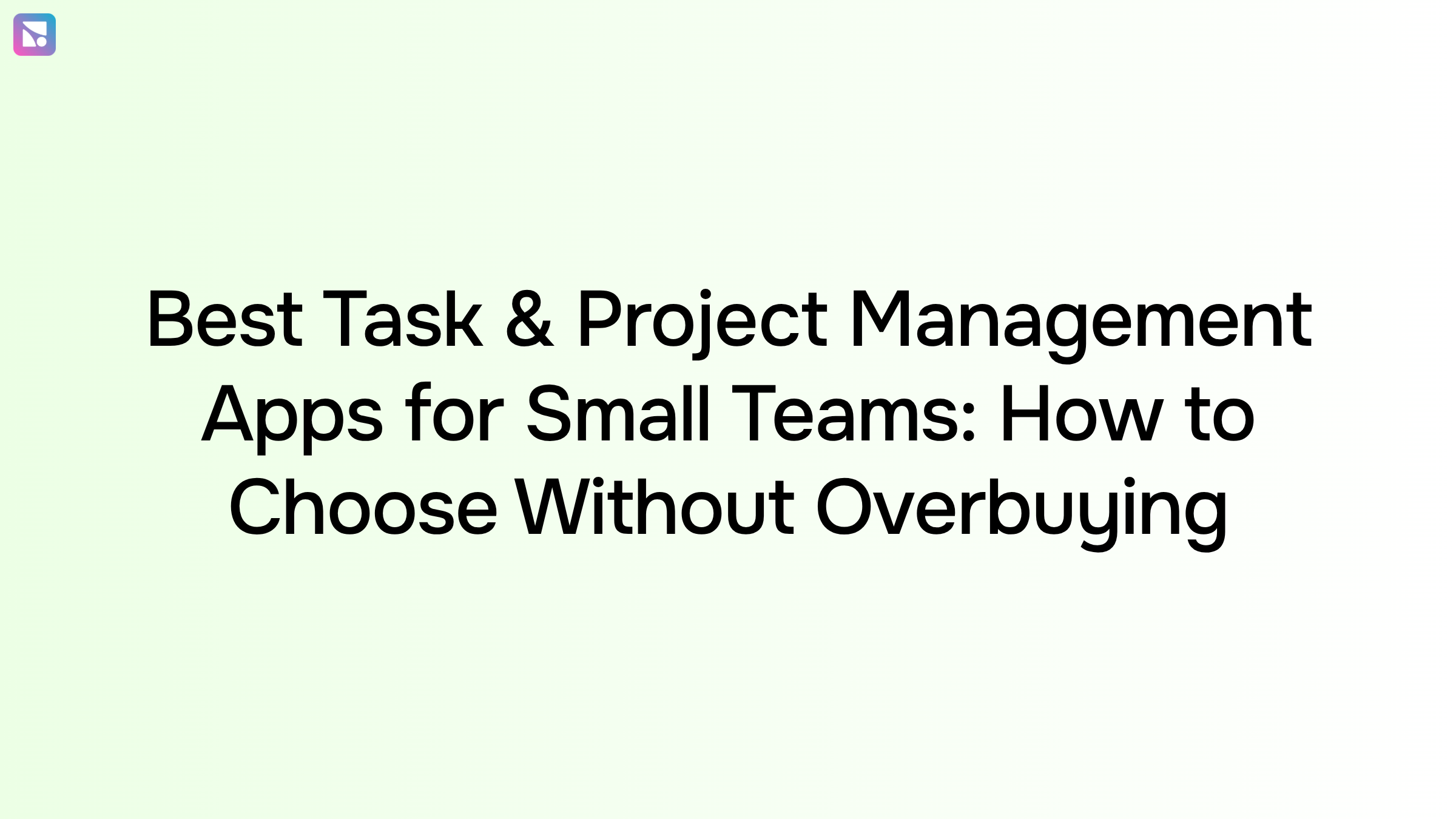 Clean overhead workspace with laptop showing task management dashboard and project planning tools