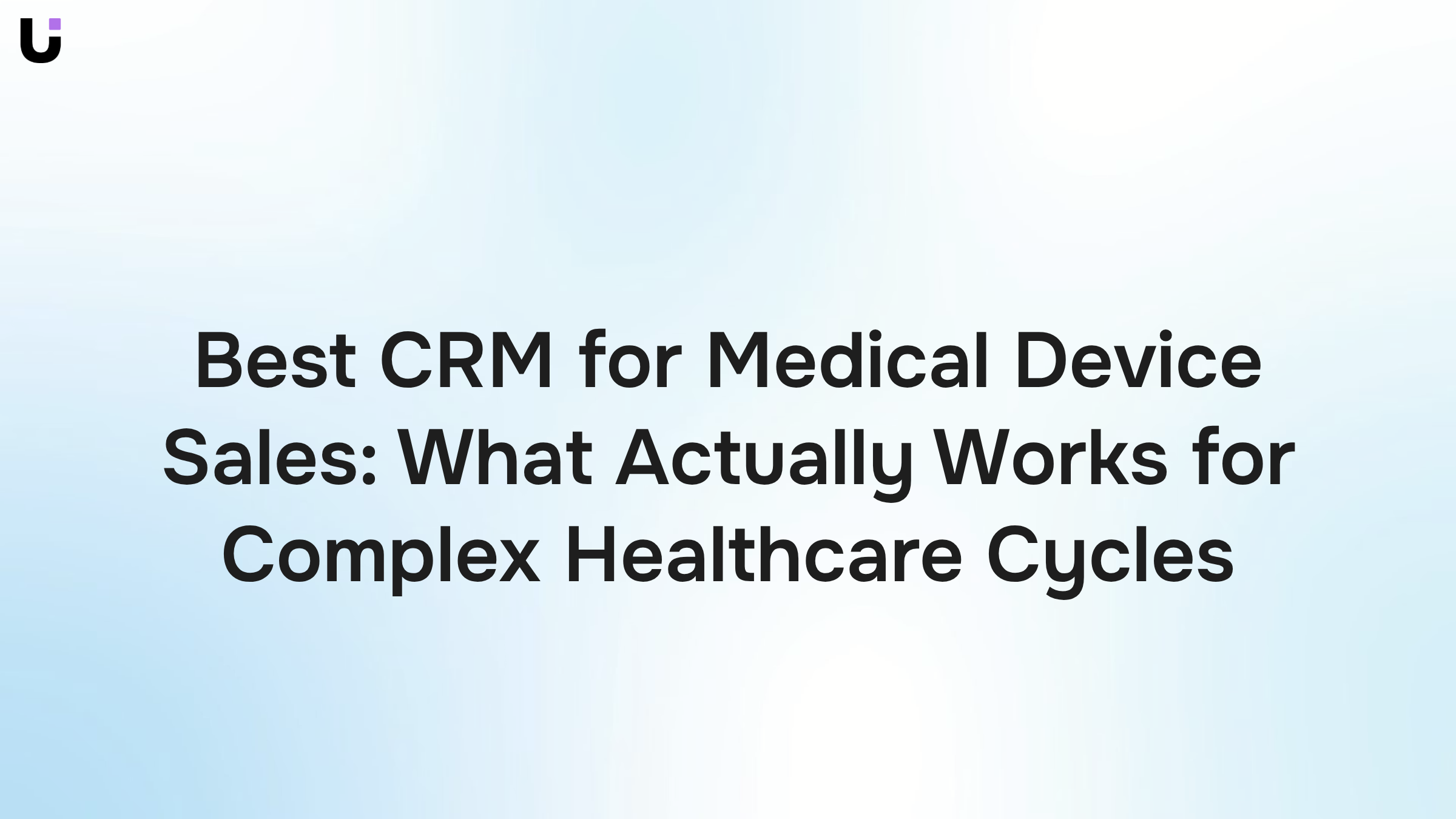 Modern healthcare sales professional analyzing CRM data on monitors with medical devices and documentation